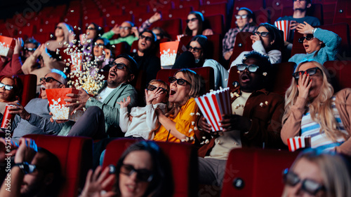 фотографія Scared audience watching 3D movie.