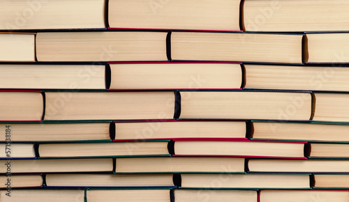 books stacked in the form of a wall