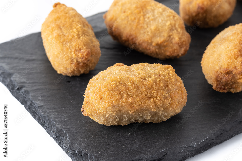 Traditional spanish fried croquettes isolated on white bckground