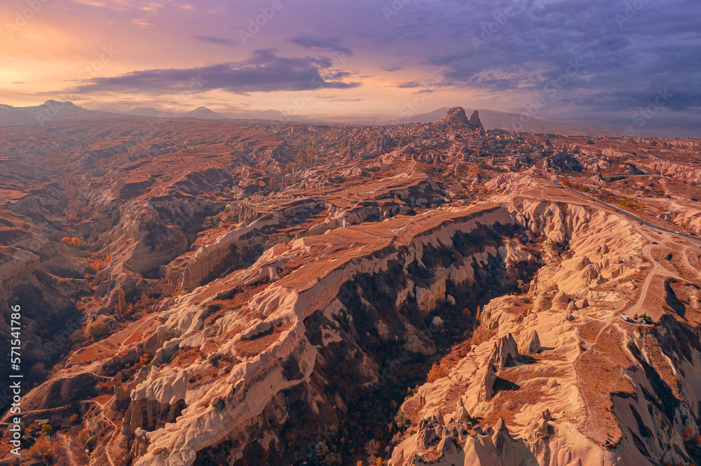 Panoramic view of Goreme national park with over deep canyons, valleys sunset Cappadocia sunset. Popular Turkey touristic place, aerial top view drone Panoramic view of Goreme national park with over deep canyons, valleys sunset Cappadocia sunset. Popular Turkey touristic place, aerial top view drone
