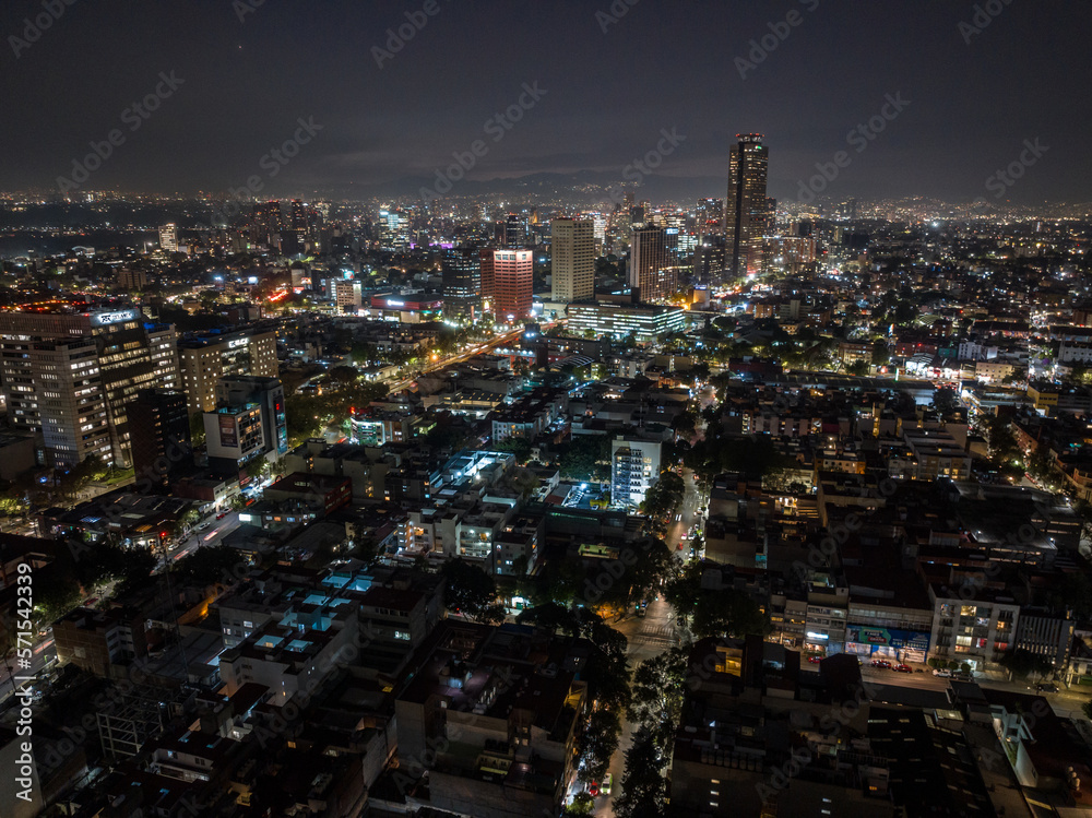 Obraz premium Beautiful aerial view of the capital of Mexico city at night.