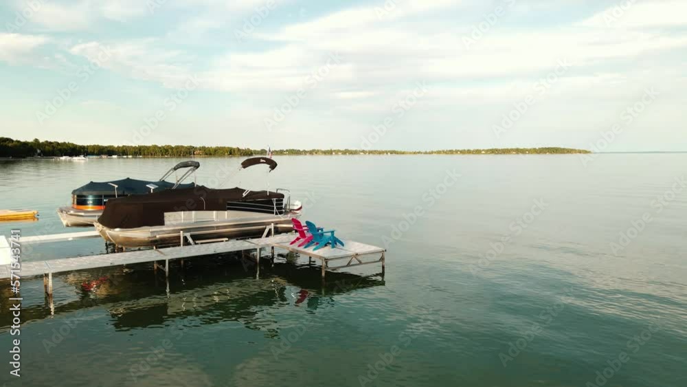 Lake Leelanau horizon and moored small motor boat, static view