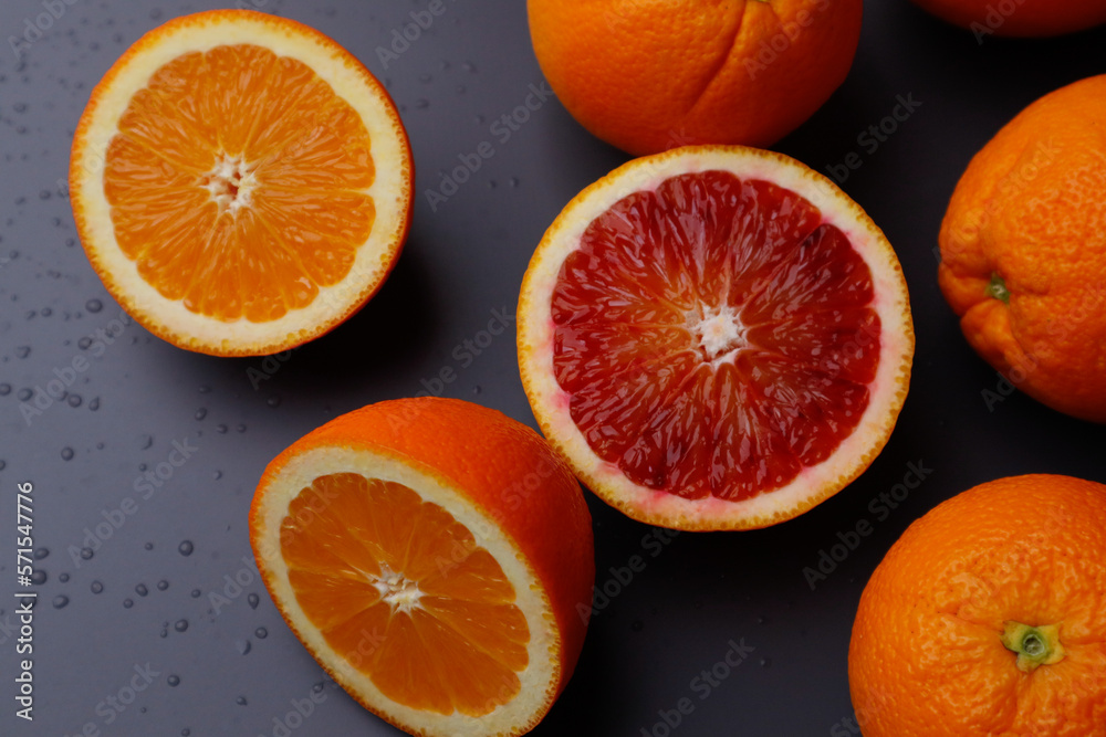 Vitamin citrus fruits on a dark background - oranges Vitamin citrus fruits on a dark background - oranges