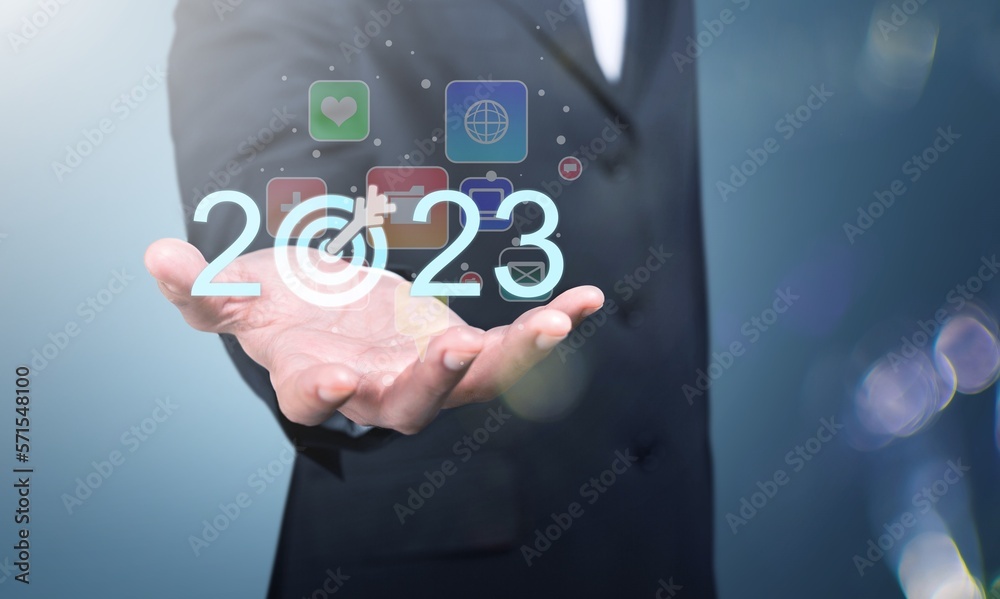 2023 concept, business person hold numbers with target 2023 concept, business person hold numbers with target