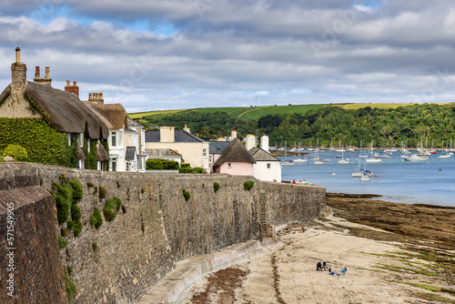 Picturesque cottages overlook the harbour in the seaside village of St Mawes on the Roseland Peninsula on the Cornish coast. photo
