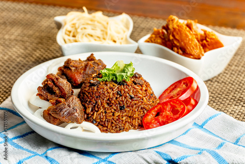 jollof with red chili paste and chicken and meat