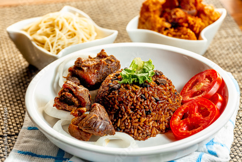 jollof with red chili paste and chicken and meat