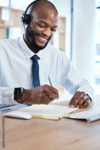 Customer service, consulting notebook and black man writing telemarketing summary for contact us CRM. Call center communication, e commerce telecom or information technology consultant on microphone