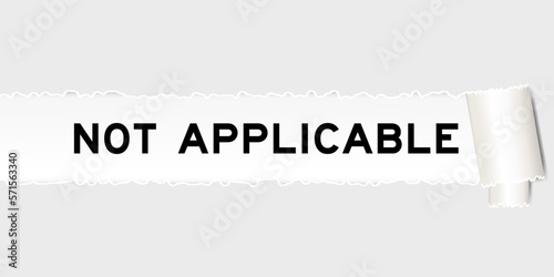 Ripped gray paper background that have word not applicable under torn part
