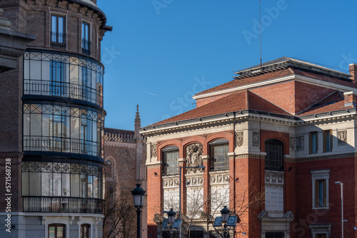 Different styles facades on the streets of Madrid. Sunny day cityscape of the capital of Spain.