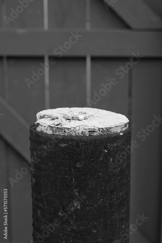 Concrete bollard top in black and white.