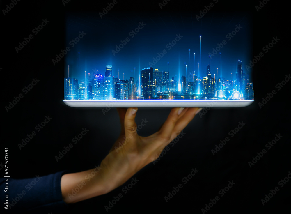 Hand hold tablet for build and make your smart city. Cityscape intelligent building, Futuristic urban hologram screen in concept of virtual internet of things and global network connection technology. - obrazy, fototapety, plakaty 