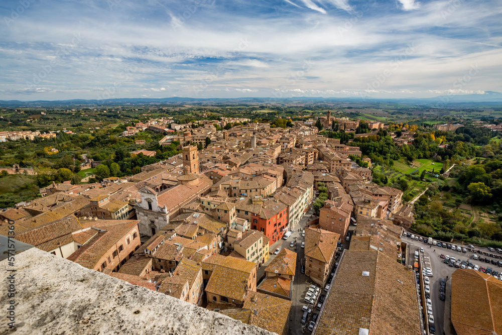Scenery high-angle, bird-eye panoramic perspective from the highest point in Siena, Tuscany, Italy, from its old brick tower. Autumn travel elevated view.