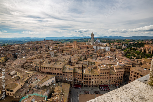 Scenery high-angle, bird-eye panoramic perspective from the highest point in Siena, Tuscany, Italy, from its old brick tower. Autumn travel elevated view.