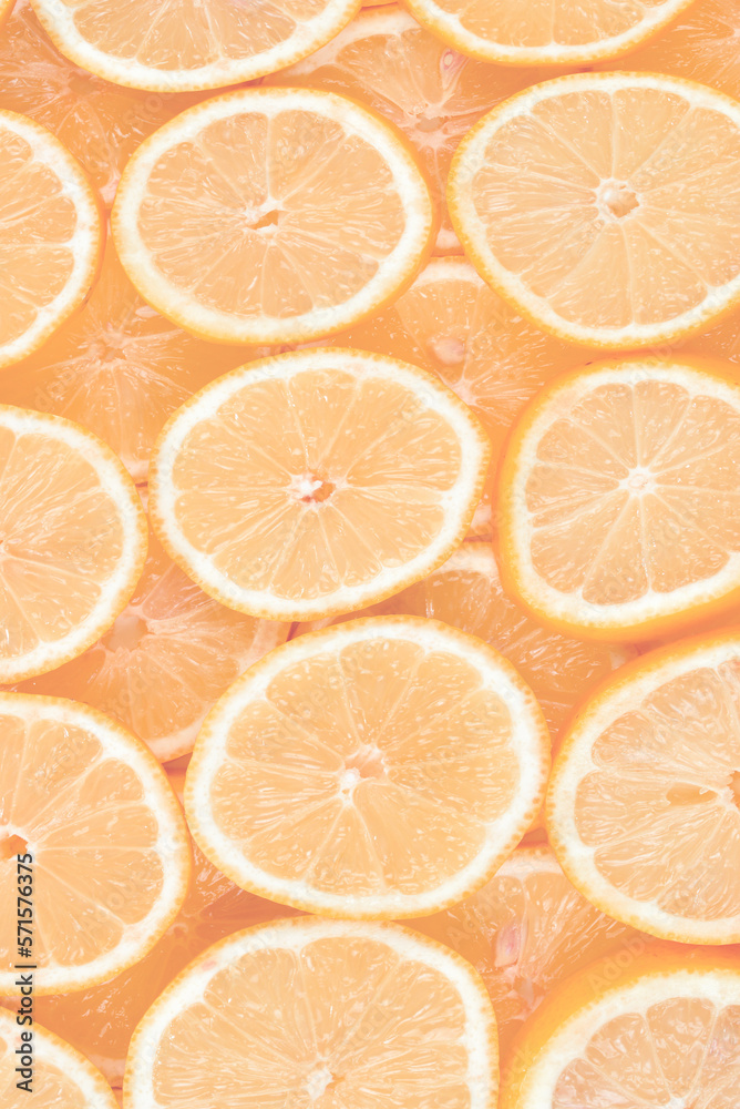 A slices of fresh juicy yellow lemons.  Texture background, pattern.