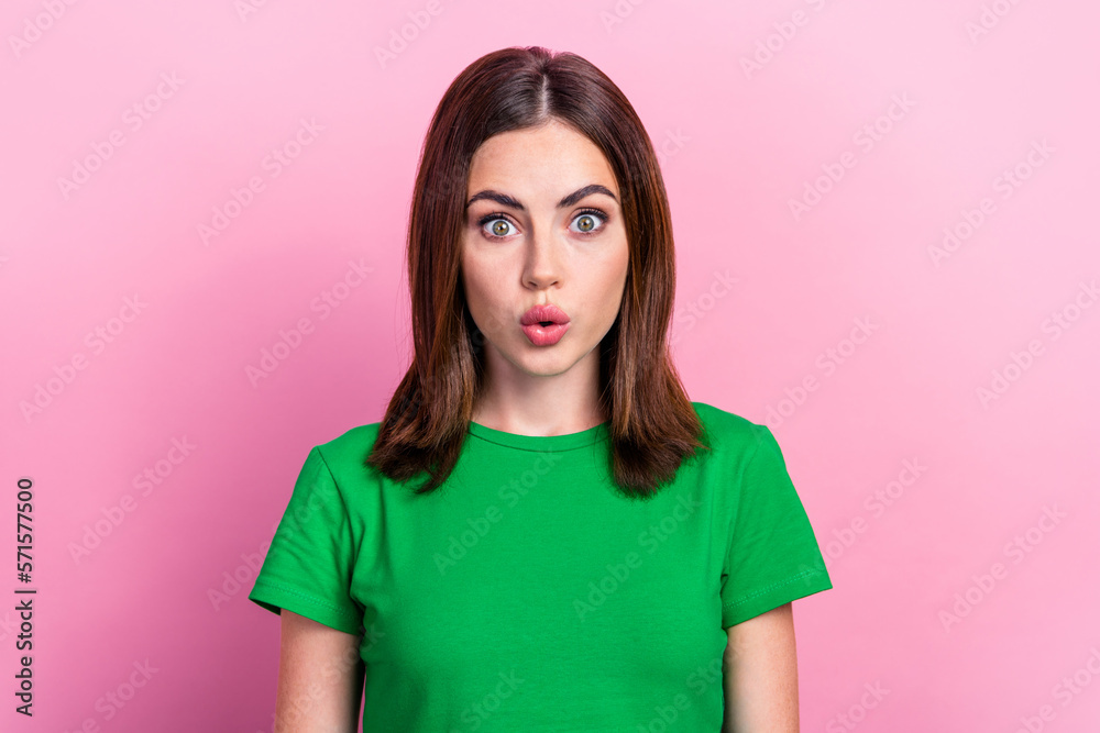 Fototapeta premium Portrait of optimistic gorgeous nice woman with straight hairdo wear green t-shirt astonished staring isolated on pink color background