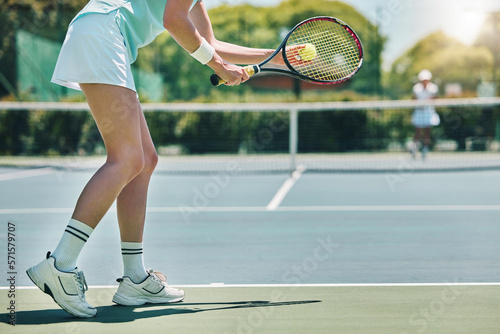 Tennis serve, sports and woman with legs on outdoor court, fitness motivation and competition with athlete training. Workout, healthy and player on turf, active with sport and exercise with action © Delcio/peopleimages.com