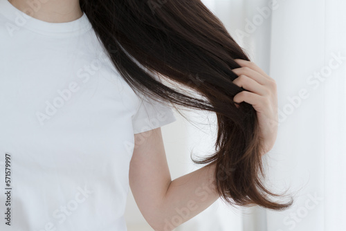 Woman brushing her hair with finger