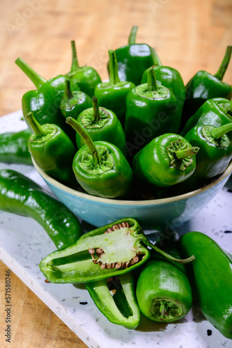 Fresh green mild padron pepper pementos, ready for grill or to be fried with olive oil, traditional snack in Galicia, Spain. photo