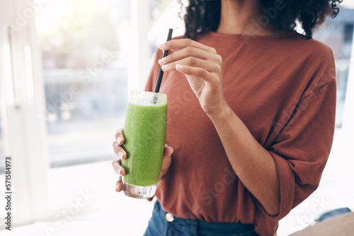 Hands, smoothie and straw with a black woman drinking a health beverage for a weight loss diet or nutrition. Wellness, mock up and drink with a healthy female enjoying a fresh fruit juice at home