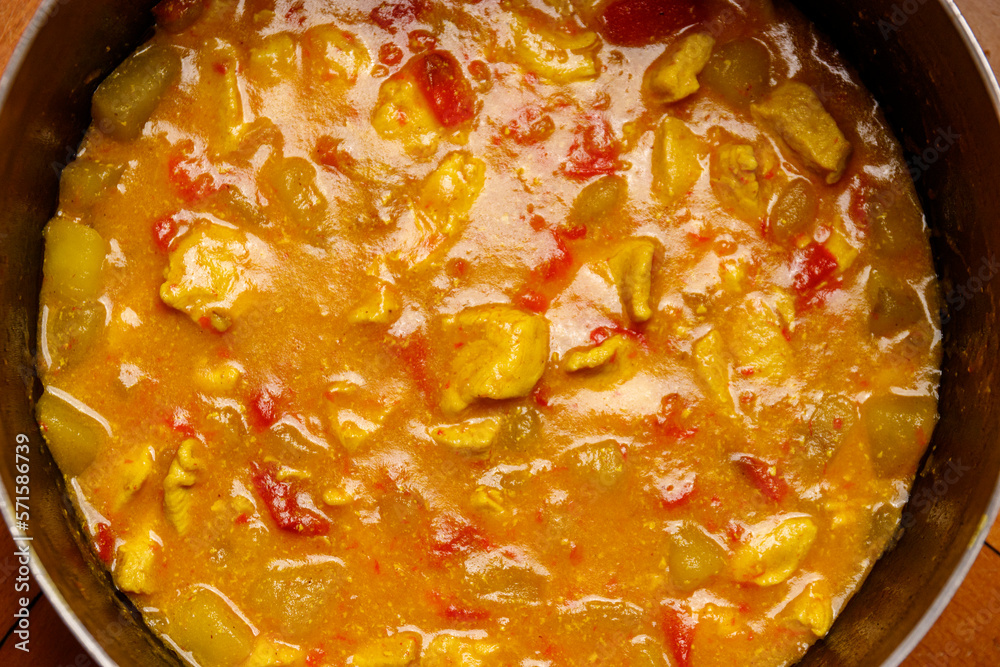 Close up of chicken curry with potatoes and peppers Close up of chicken curry with potatoes and peppers