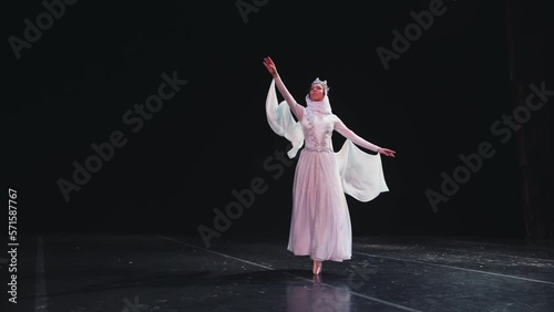  video footage beautiful elements of classic ballet ballerina dancing on black background, slow motion photo