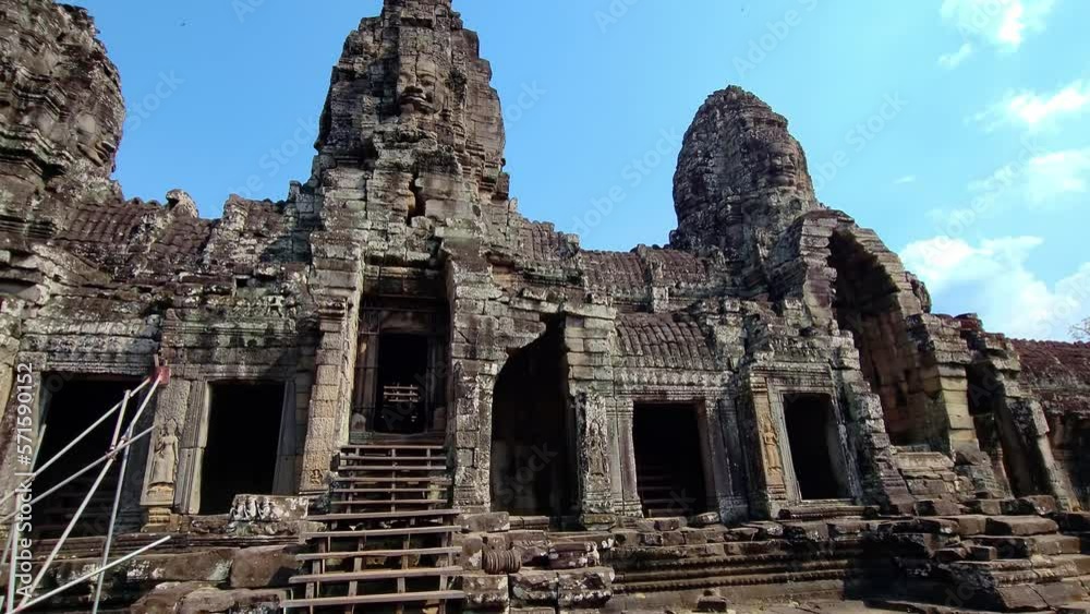 Ancient ruins Thom Bayon temple - famous Cambodian landmark, Angkor Wat complex of temples. Siem Reap, Cambodia. Ancient ruins Thom Bayon temple - famous Cambodian landmark, Angkor Wat complex of temples. Siem Reap, Cambodia.