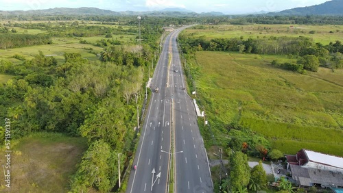 4K aerial view of road and home,beautiful nature in the morning,shot from top view,fly straight ahead