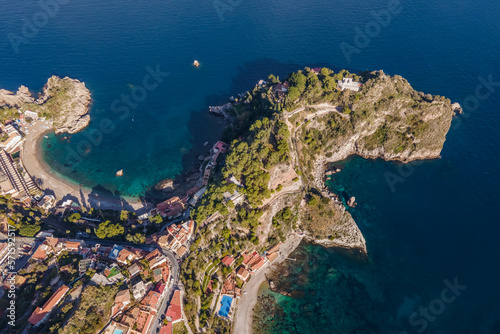 Aerial view of the Blue Cave (Grotta Azzurra) on the promontory along the coastline in Taormina, Messina, Sicily, Italy. photo