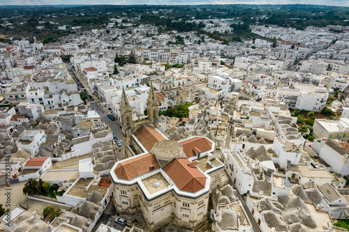 Aerial view of Basilica of Saints Cosmas and Damian, Alberobello, Puglia, Italy. photo