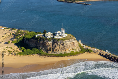 Aerial view of Nobbys Lighthouse on the Ocean waterfront in New Castle, New South Wales, Australia. photo