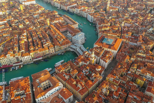 Aerial view of Rialto bridge crossing the Grand Canal in Venice downtown, Veneto, Italy.