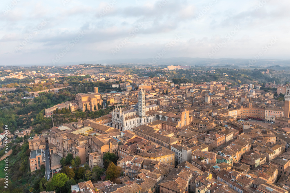 Panoramic aerial view of Siena cathedral in Siena downtown at sunset, Tuscany, Italy. Panoramic aerial view of Siena cathedral in Siena downtown at sunset, Tuscany, Italy.