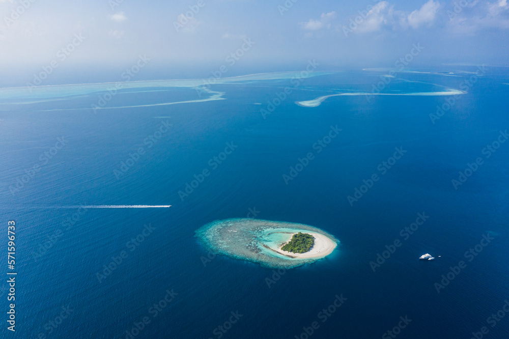 Aerial view of a few Atolls surrounded by the Indian Ocean, Maldives archipelagos. Aerial view of a few Atolls surrounded by the Indian Ocean, Maldives archipelagos.