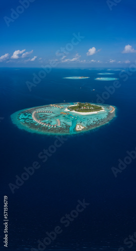 Dhigurah, Maldives - 09 December 2023: Panoramic aerial view of Centara Grand Island Resort and Spa on Maldives archipelagos. photo