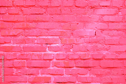 Toned in light pink color brick wall texture as background