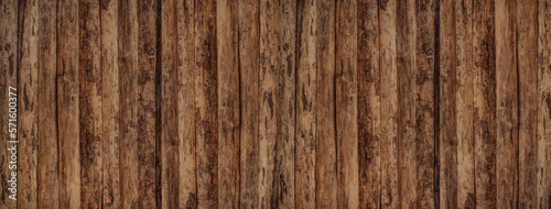 Wooden fence in vintage style. Abstract background. Destroyed surface in brown tones. 