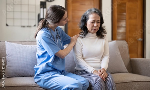 Female doctor holding female patient hands with compassion and comfort for encouragement and empathy