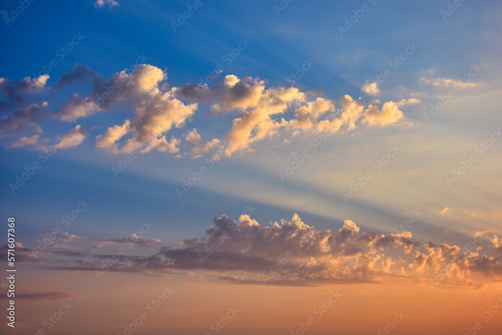 Fluffy textured white clouds in a pastel blue sky. Pastel blue sky with fluffy white clouds at sunset, panoramic background Fluffy textured white clouds in a pastel blue sky. Pastel blue sky with fluffy white clouds at sunset, panoramic background