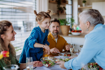 Happy multigenertional family having Easter dinner together.