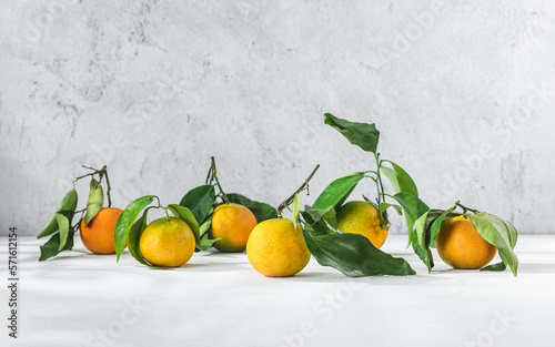 Orange mandarin on white table