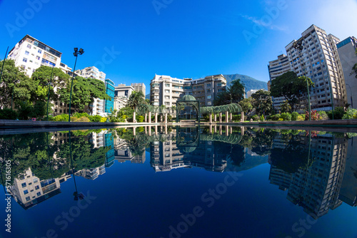 North view of Plaza Altamira in Chacao  Caracas Venezuela. Reflecting pool showing Edificio Altamira  one of the oldest buildings in the area. 