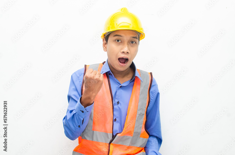 overjoyed asian male construction worker opening mouth shocked and surprised. construction worker with wow expression.