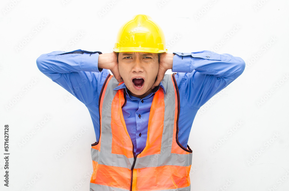stressed over work concept illustrated by asian male construction worker in blue shirt, orange vest and yellow safety helmet with furious, mad, sad, angry expression. overworked concept stressed over work concept illustrated by asian male construction worker in blue shirt, orange vest and yellow safety helmet with furious, mad, sad, angry expression. overworked concept