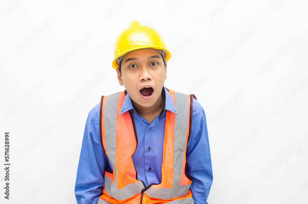 overjoyed asian male construction worker opening mouth shocked and surprised. construction worker with wow expression. overjoyed asian male construction worker opening mouth shocked and surprised. construction worker with wow expression.