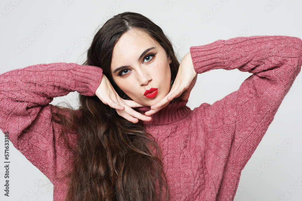 charming smiling young woman with long dark hair dressed pink sweater charming smiling young woman with long dark hair dressed pink sweater