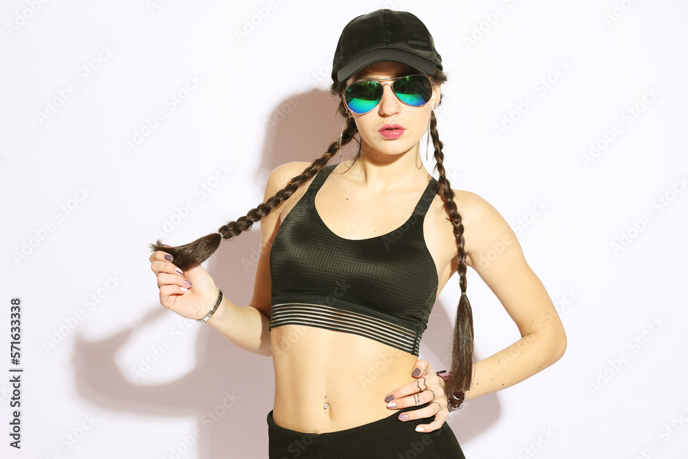Having a trendy look. Portrait of beautiful young woman with braids smiling at camera