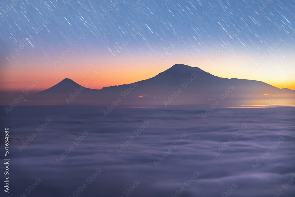 Beautiful landscape after the sunset with starry sky over the mountains. Ararat mountain.  