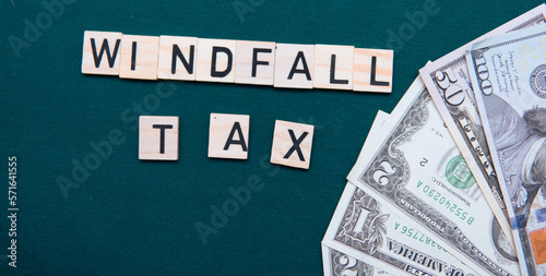 Φωτογραφία inscription windfall tax next to US dollars