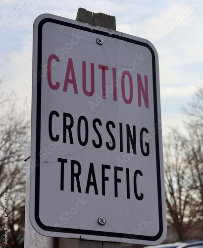A close view of the caution crossing sign.